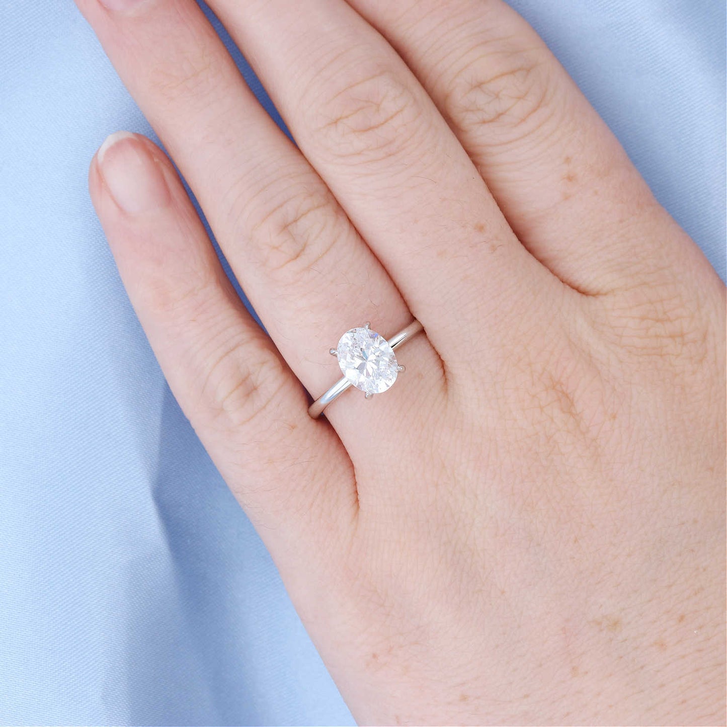 Oval Solitaire Hidden Halo Engagement Ring