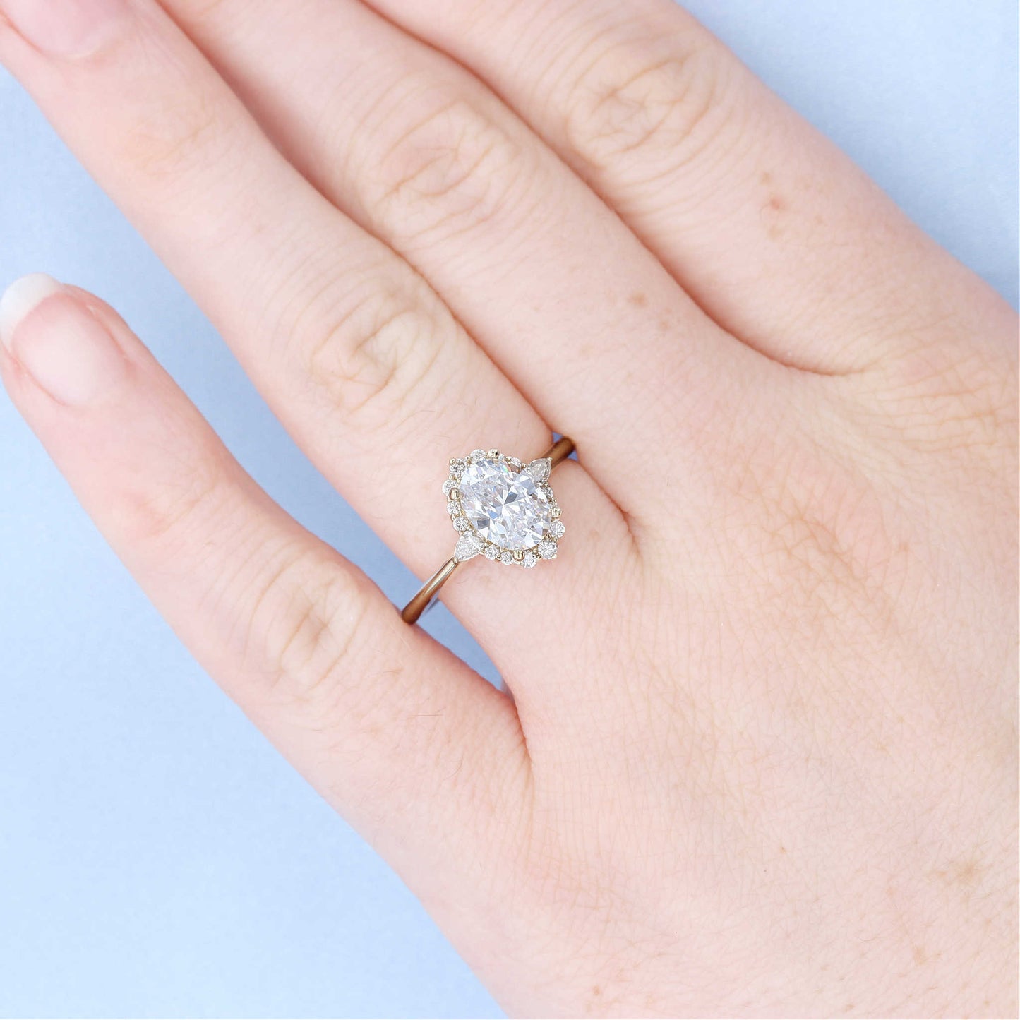 Tapered Halo Oval Diamond Engagement Ring