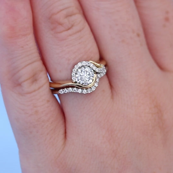 Swish Bypass Diamond Halo Engagement Ring on a Finger with Matching Shadow Band