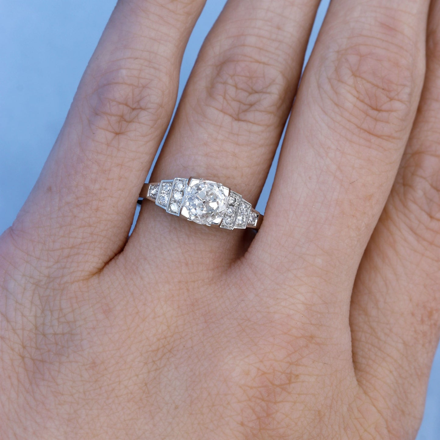 Platinum Geometric Art Deco Diamond Engagement Ring Replica on a Finger