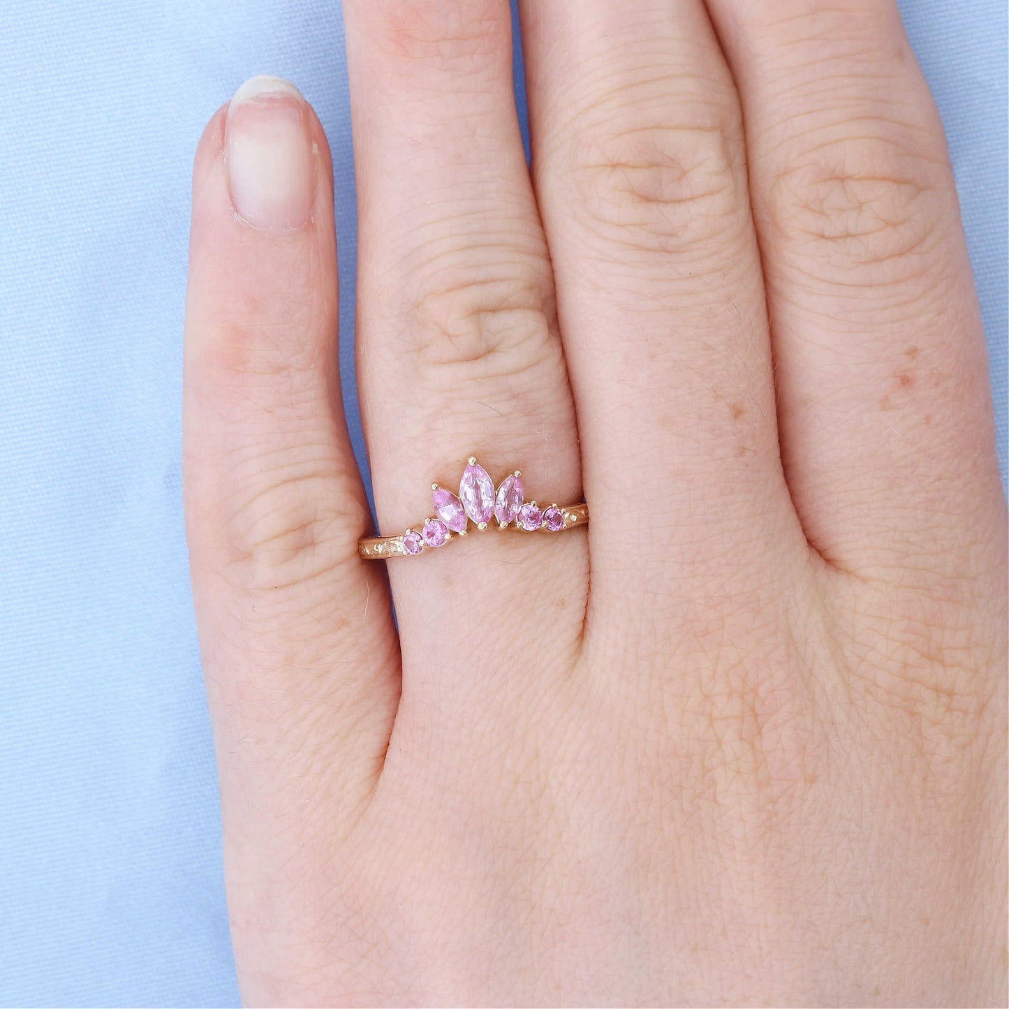 Pink Sapphire Engraved Contour Wedding Band on a Finger