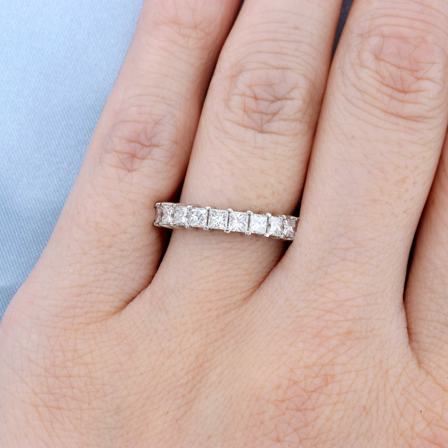 Two Tone Princess Cut Diamond Wedding Band on a Finger