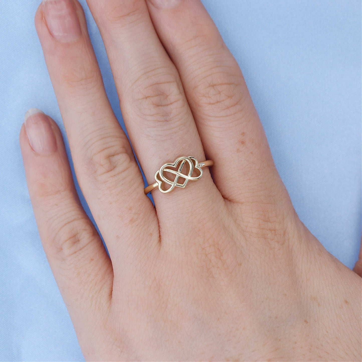 Infinity Heart Ring on a Finger